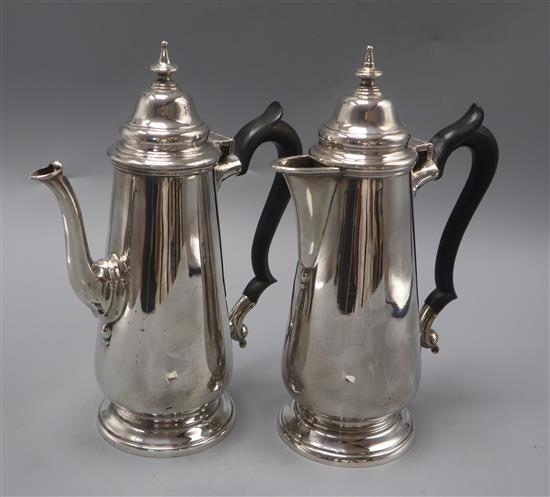 A matched silver cafe au lait pair, London, 1909 and London, 1938, gross 29.5 oz.